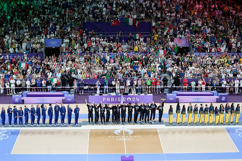 Gold medalist Italy, center, silver medalist United States and bronze medalist Brazil, right, stand on the podium during the victory ceremony